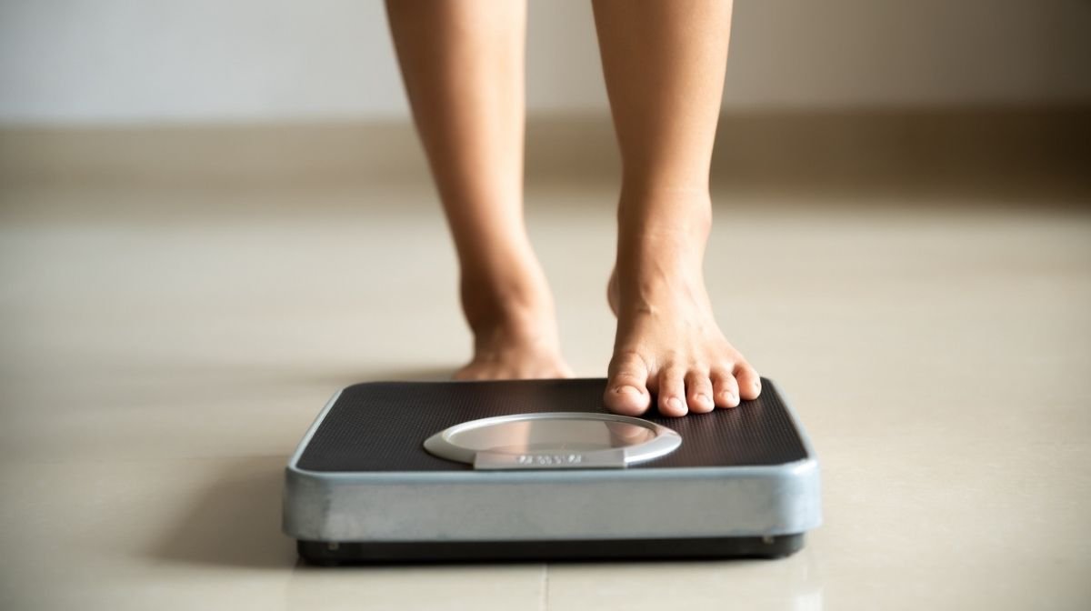 woman standing on scales