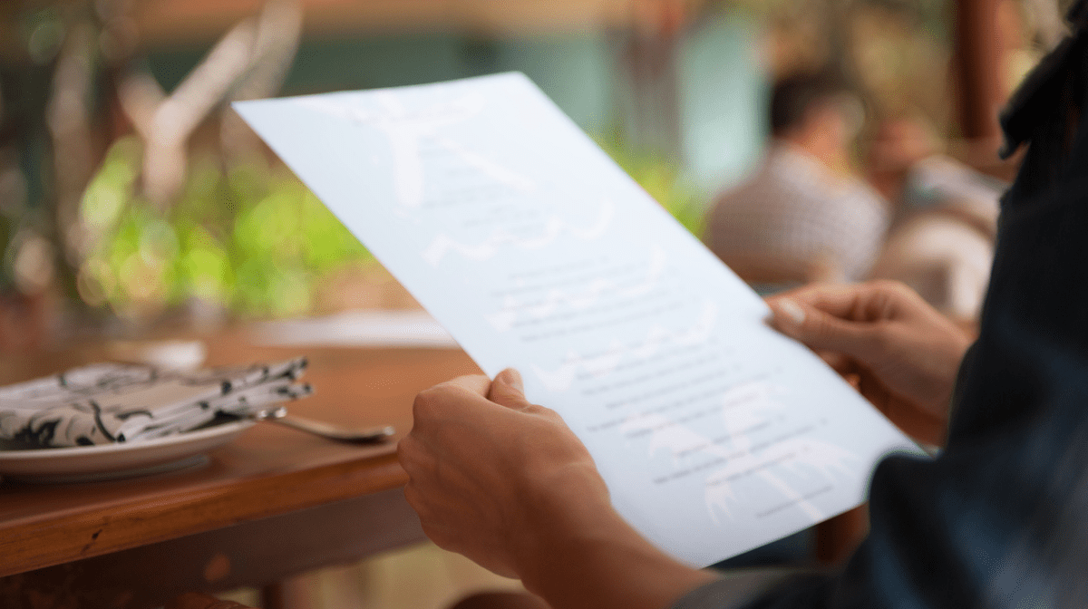 A person reading the menu. 