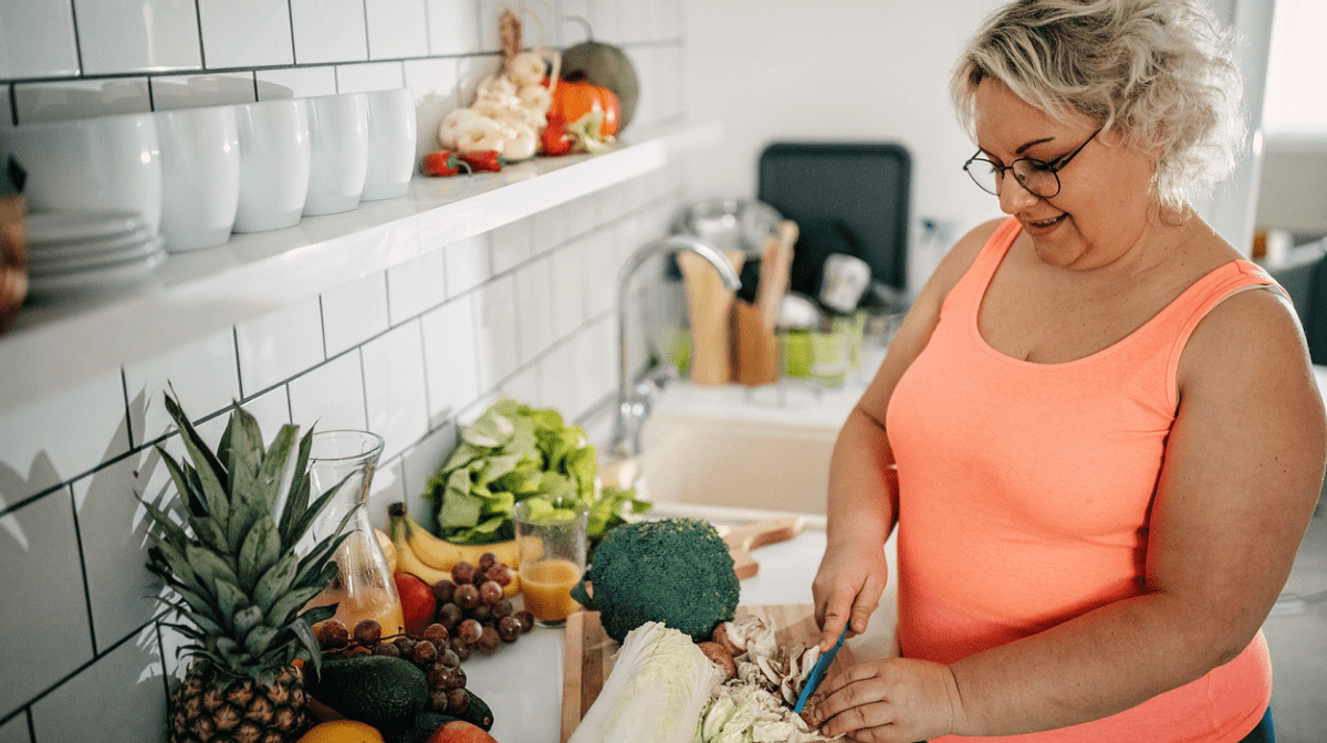 woman preparing low calorie meals to support weight loss