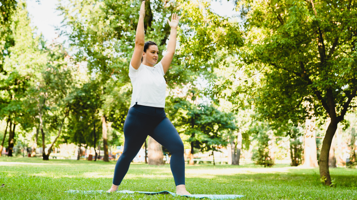 woman exercising outdoors in park