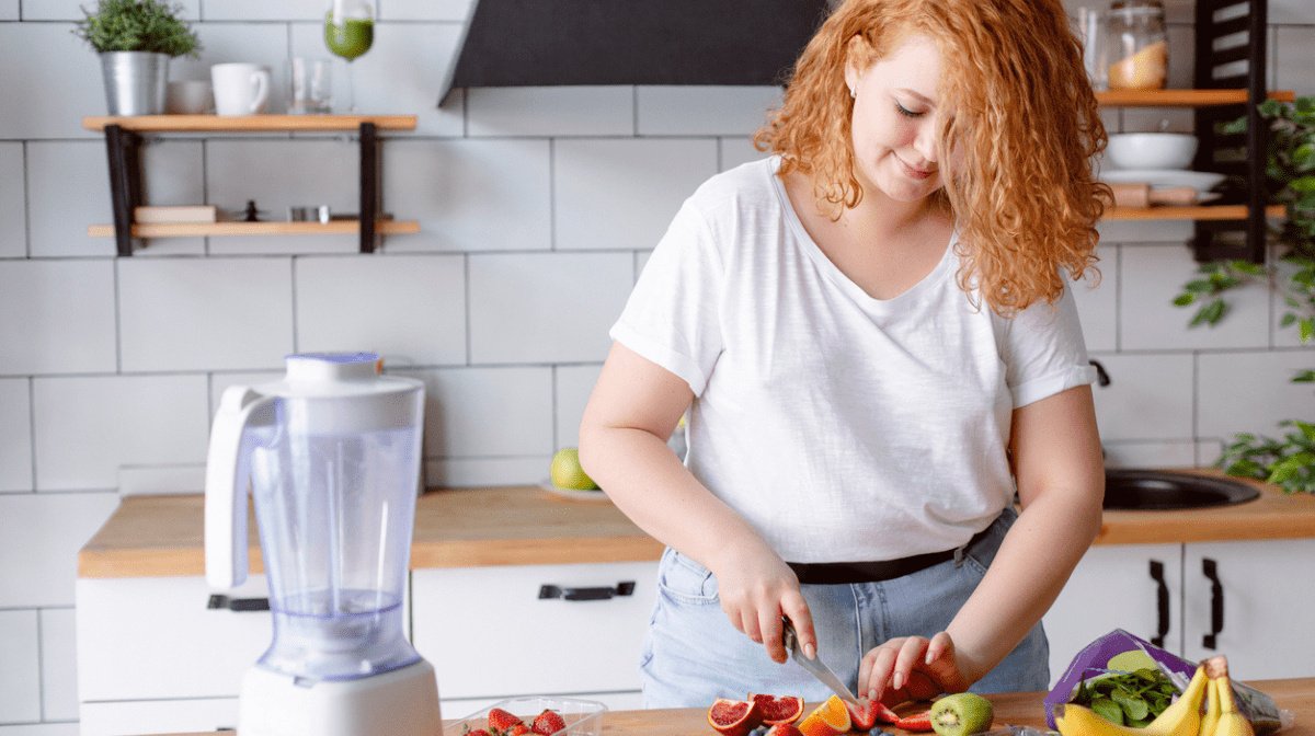 A woman preparing a healthy meal in the kitchen