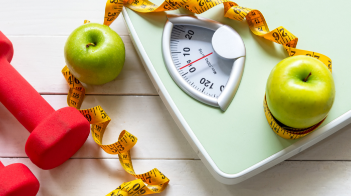 green apple and weight scale measure tap