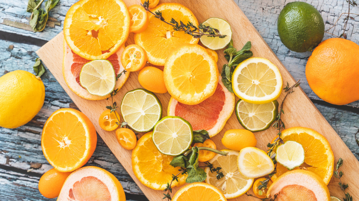 citrus fruits cut open on a chopping board as source of vitamin C