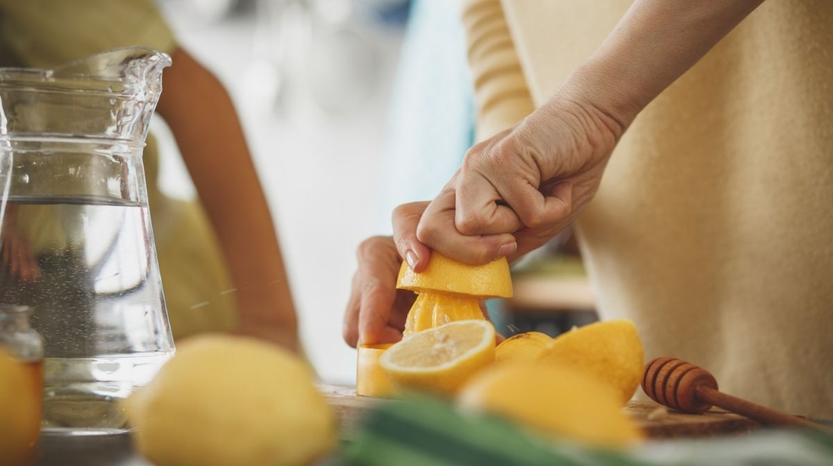 Image of woman juicing citrus fruit