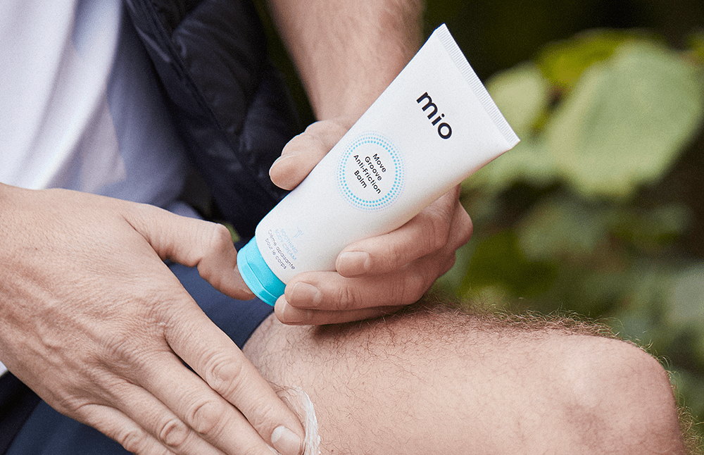 mio anti-friction balm being put on leg before exercise