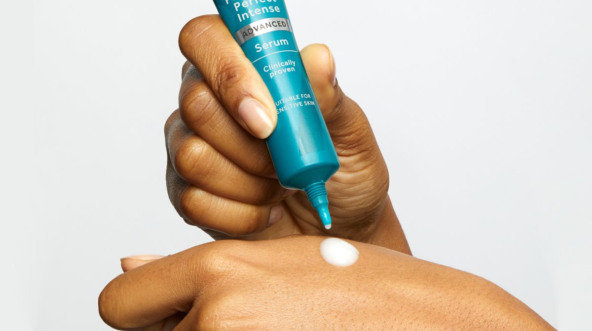 No7 Protect & Perfect Intense Advanced Serum being squeezed onto hand
