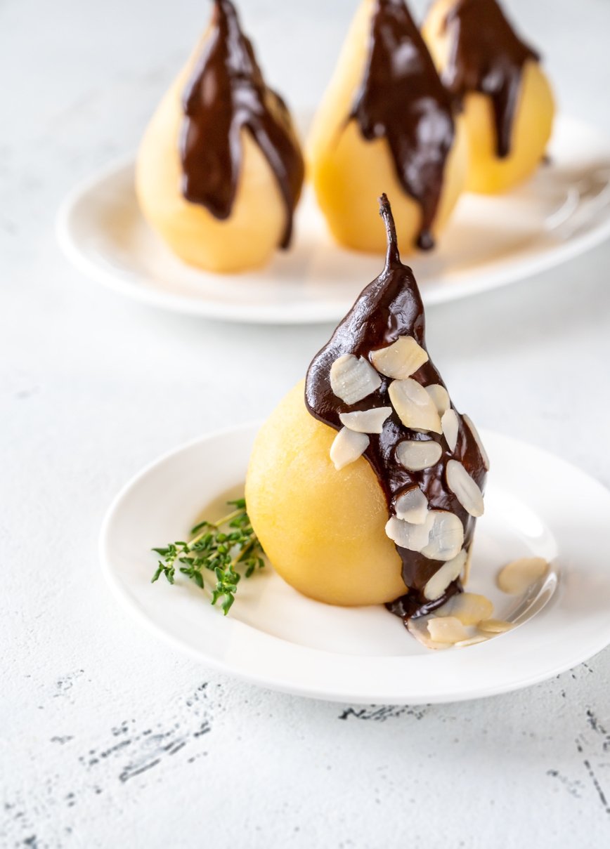 Poire belle Helene - French dessert made from poached pear served with chocolate syrup