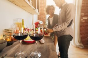 Romantic black couple preparing healthy meal together