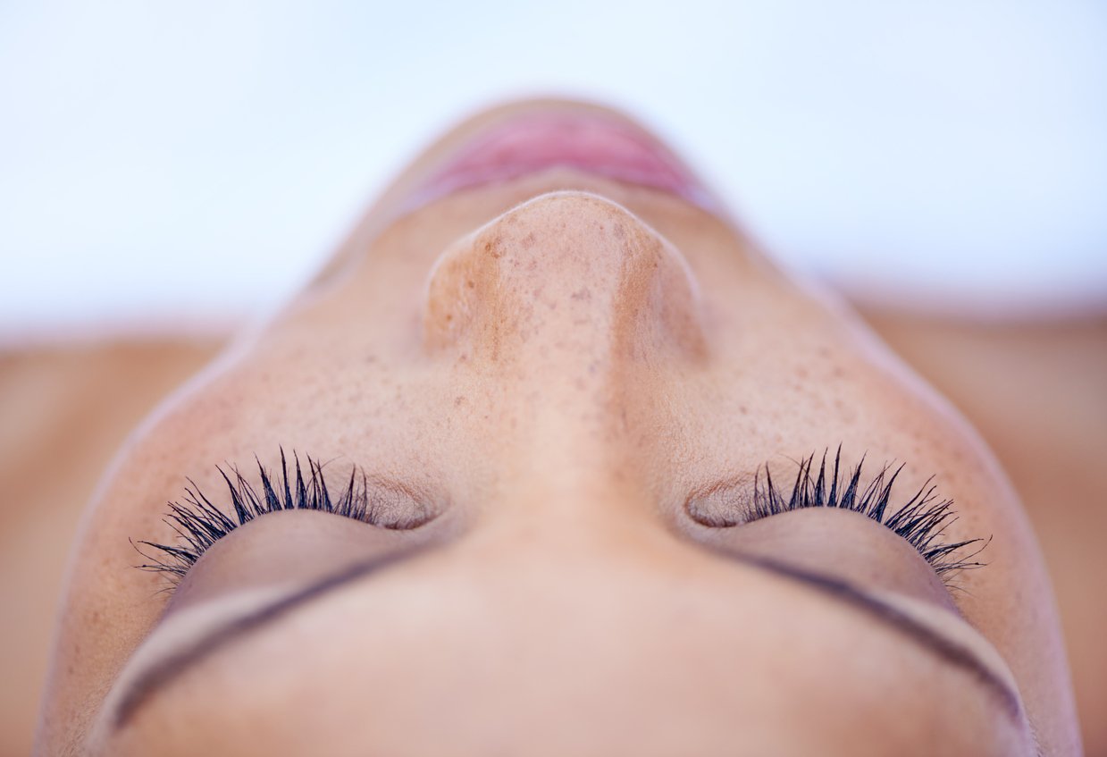 Cropped shot of an attractive young woman lying on her back