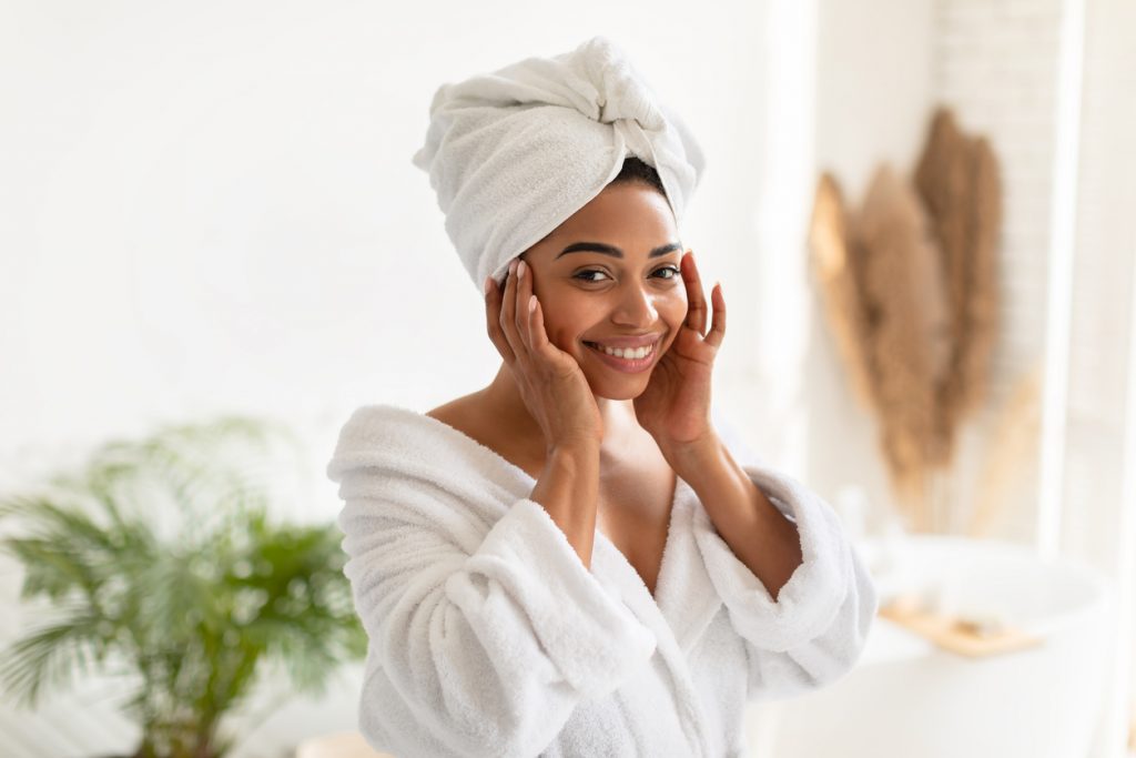 Woman applying skincare