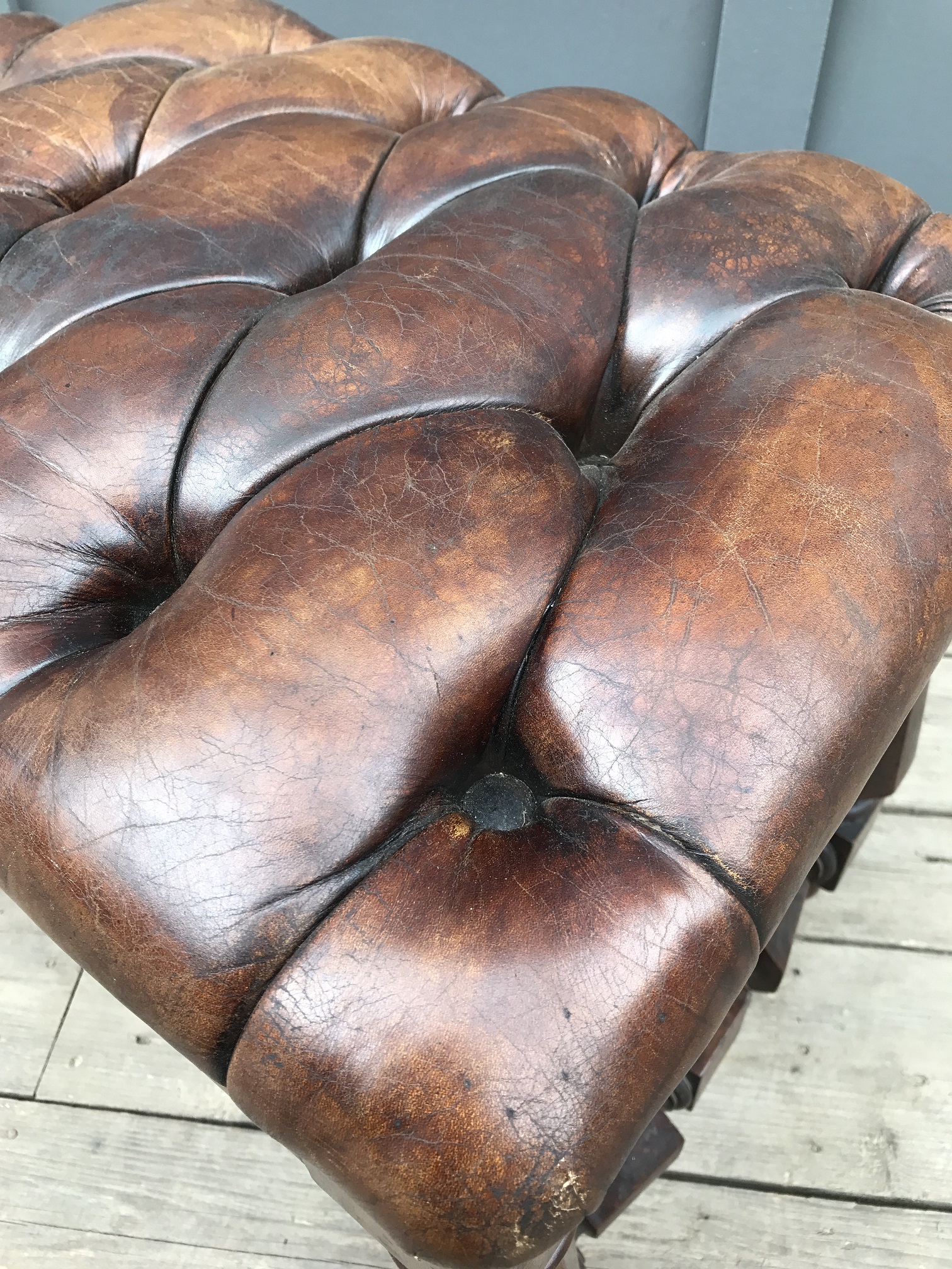 vintage buttoned leather footstool leather detail