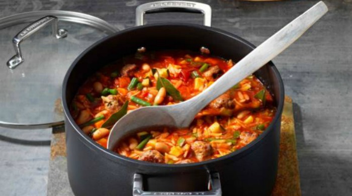 A pot of mini meatballs soup.