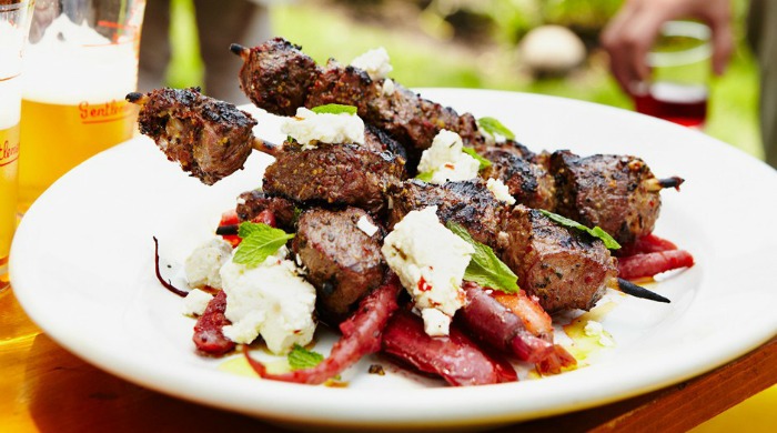 A plate of grilled lamb kebabs.