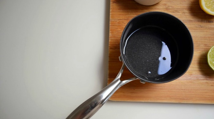 A frying pan with coconut oil in it.