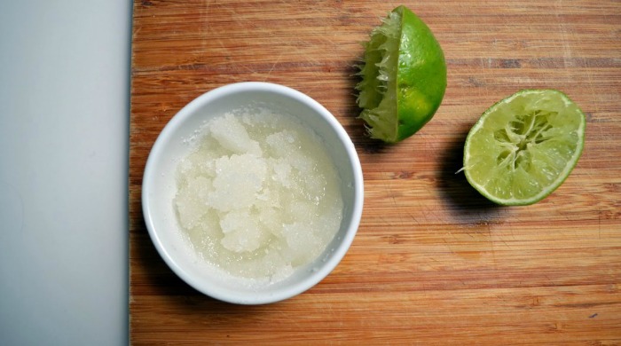 A bowl of coconut oil and sugar scrub exfoliator.