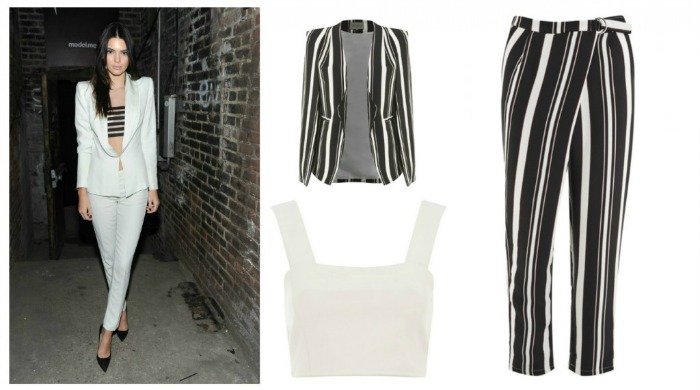Kendall Jenner wearing a white trouser suit and striped bandeau.