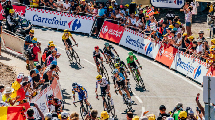 How do you get to compete in the Tour de France?