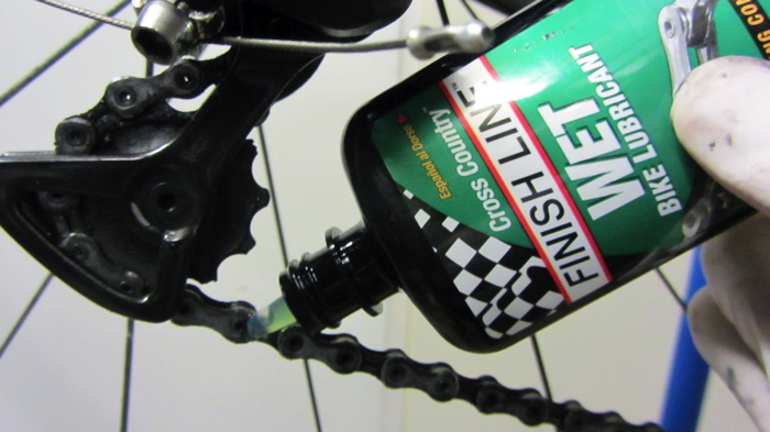 finish line cycling product being used on a road bike winter