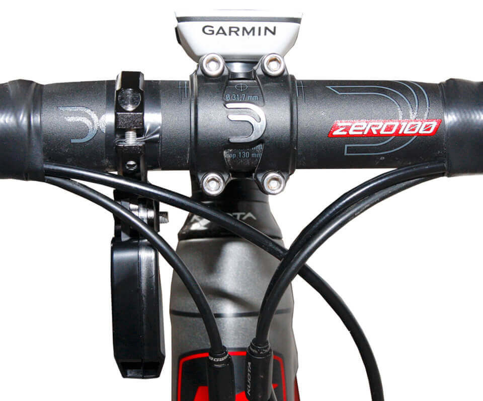 A powerpod power meter attached to the handlebars of a road bike