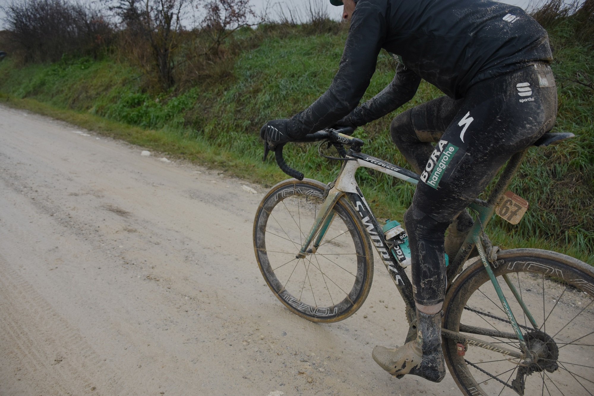 a bora hangrohe rider in sportful kit covered in mud