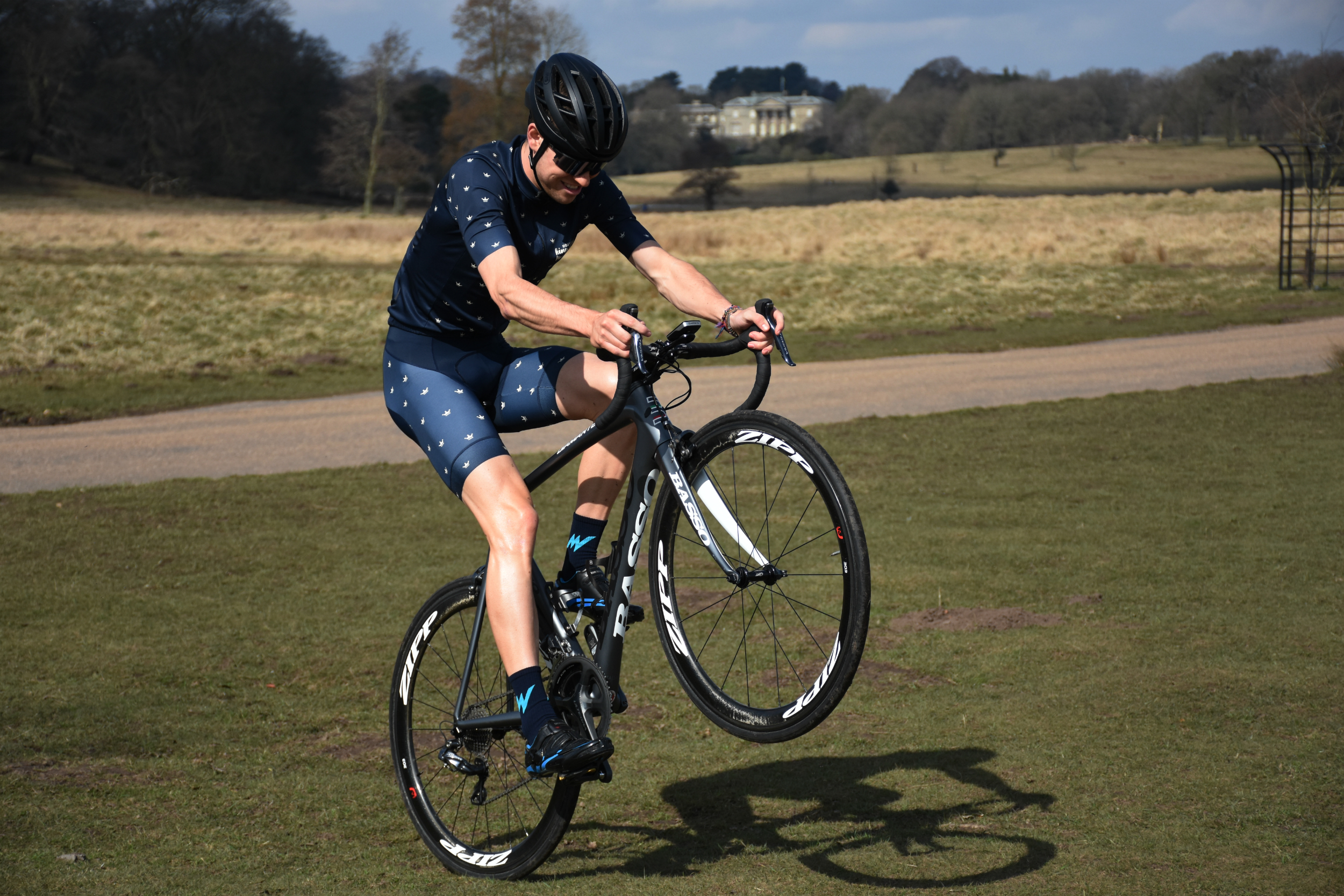 A cyclist doing a wheelie in the morvelo SS18 KOM kit