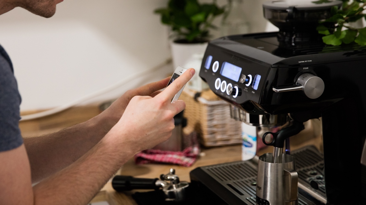 jm taking a picture of the smiley face symbol on the sage by heston blumenthal coffee maker