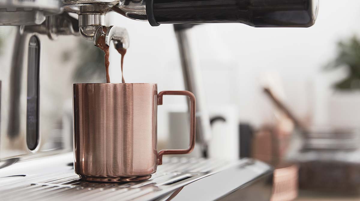 sage by heston blumenthal the oracle coffee machine in the iwoot kitchen with copper mug