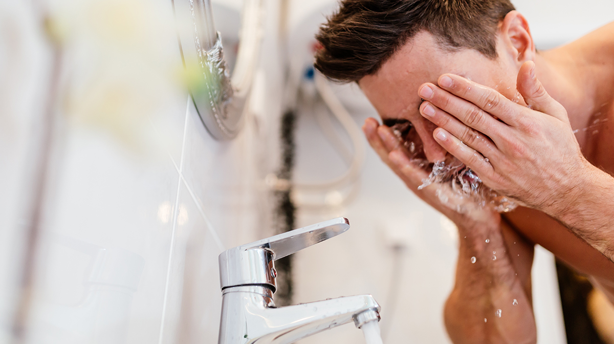 Man Washing face