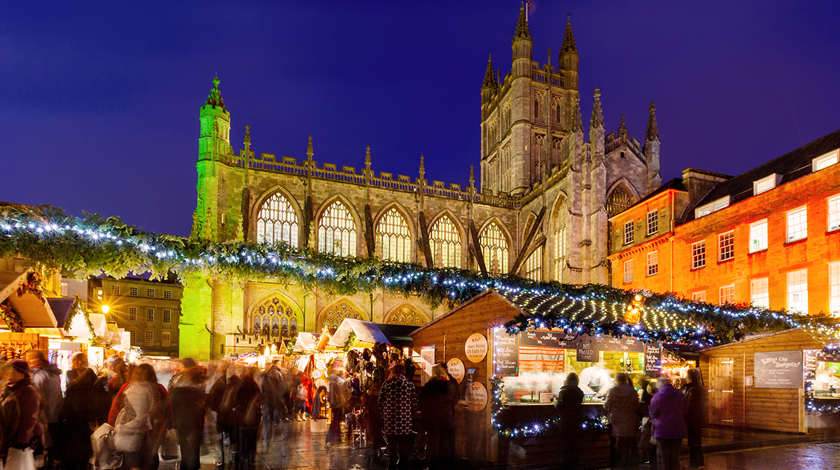 Bath Christmas Market at night in front of Cathedral