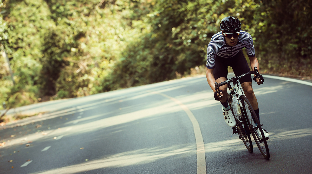 Man cycling on road