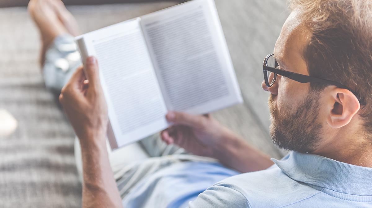 Man with glasses reading