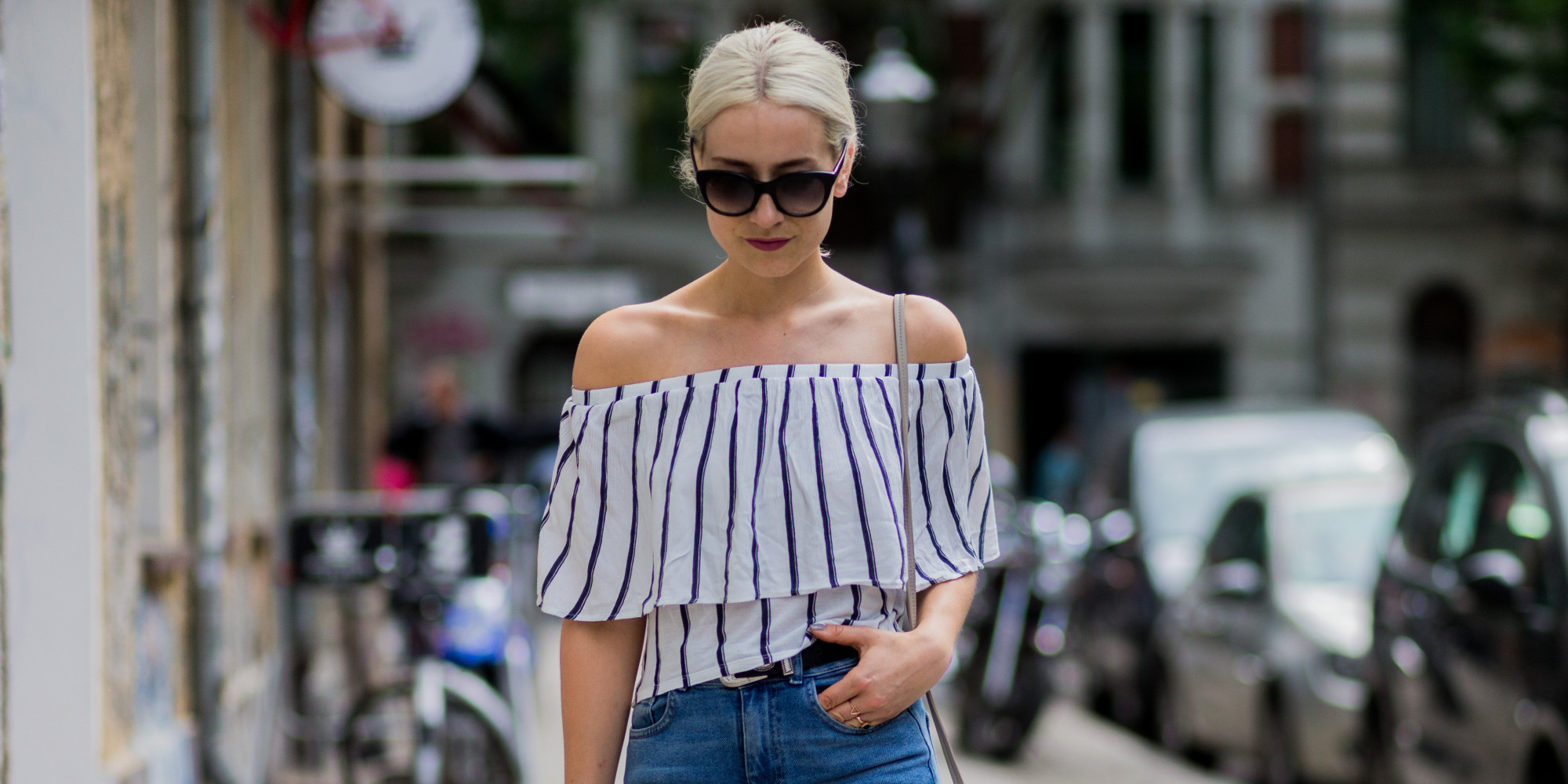 BERLIN, GERMANY - MAY 29: Miriam Mache wearing a white navy striped off shoulder shirt from Zara, a Radley London bag, blue BDG denim jeans, Rodenstock sunglasses on May 29, 2016 in Berlin, Germany. (Photo by Christian Vierig/Getty Images)