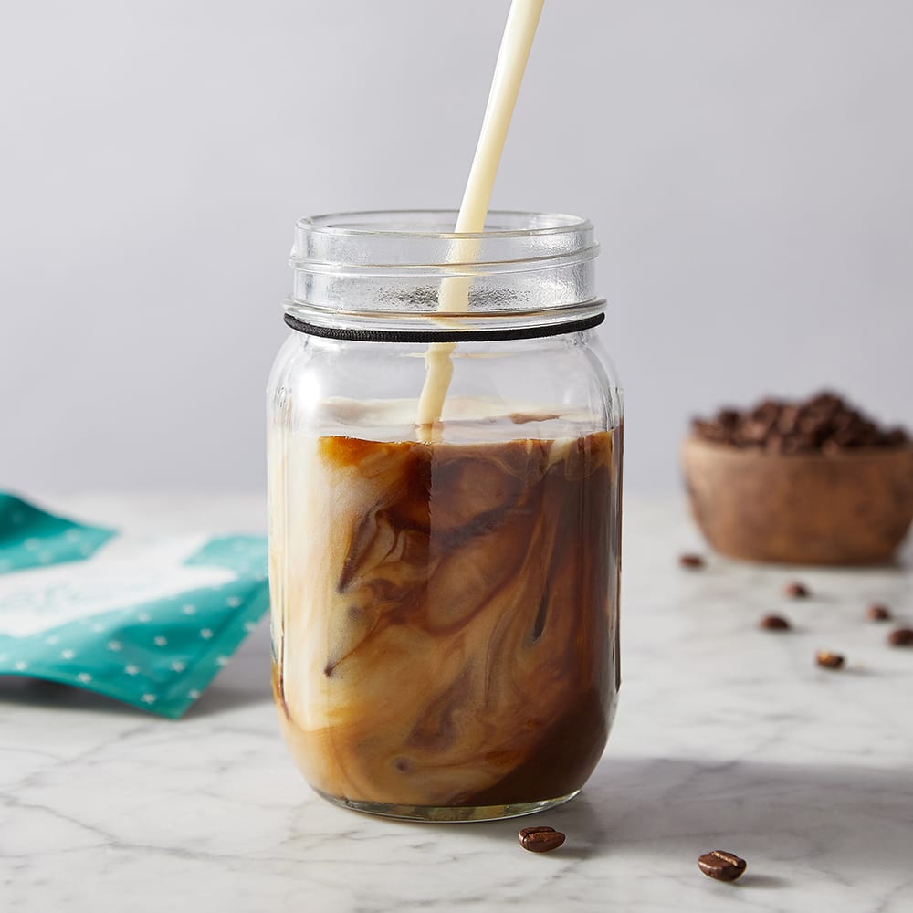 coffee smoothie being poured into glass