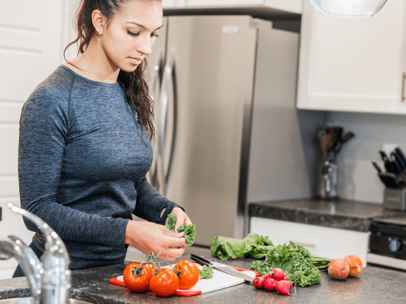 A woman slicing vegetables