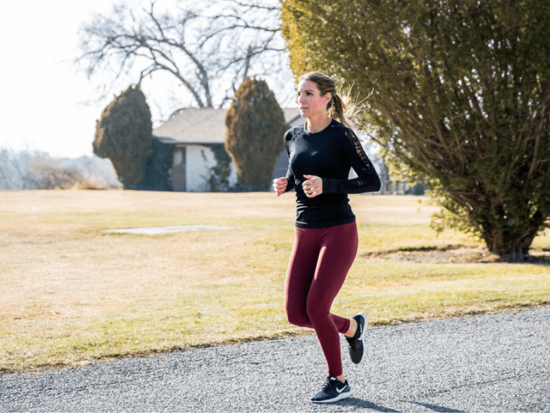 A woman running using energy she acquired from a plant-based diet