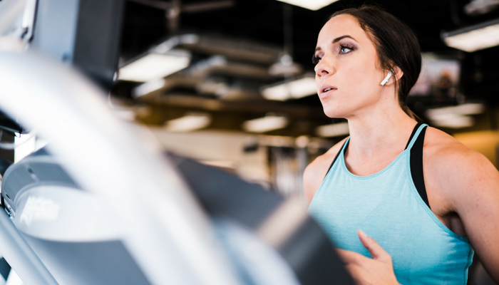 female running on treadmill