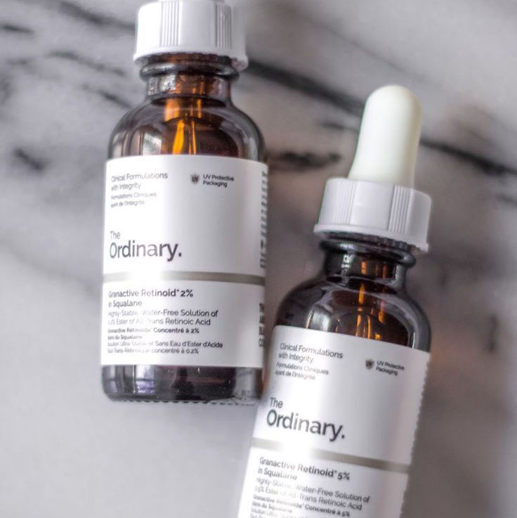 The Ordinary Skincare Granactive Retinoid 2% two bottles on marble