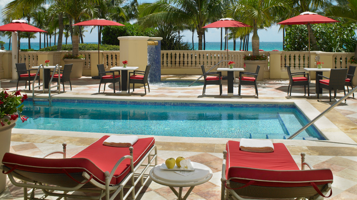 red loungers and outdoor pool