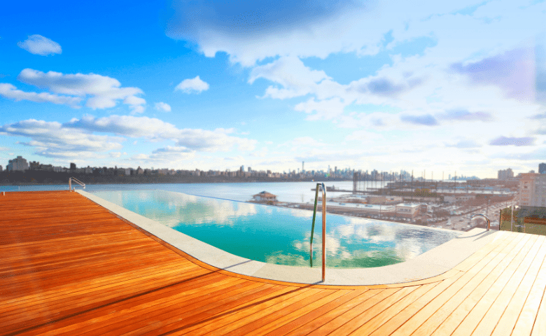 Infinity pool overlooking New York City in the sun