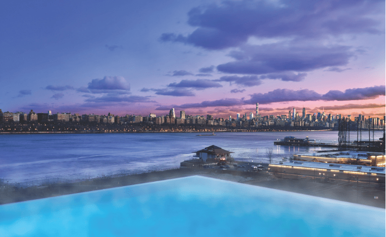 Pool overlooking New York City at sunset