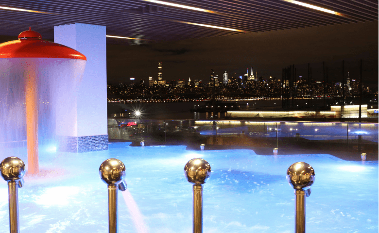 Hydrotherapy pool with jets overlooking New York City at night