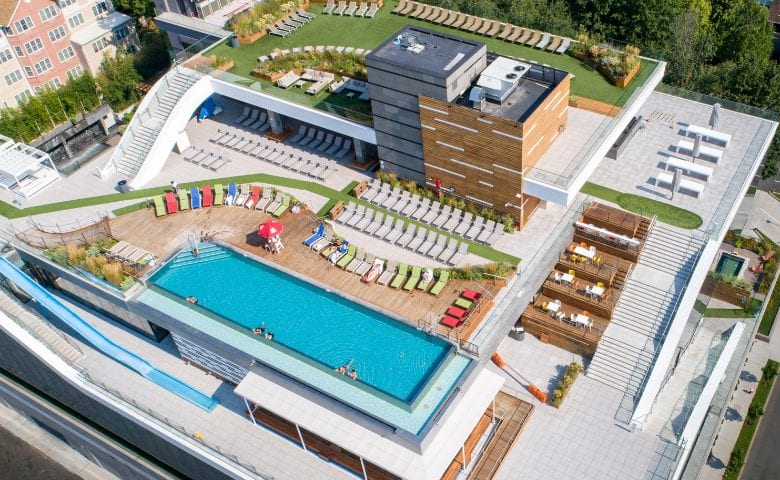 Rooftop of SoJo spa with infinity pool and sun loungers