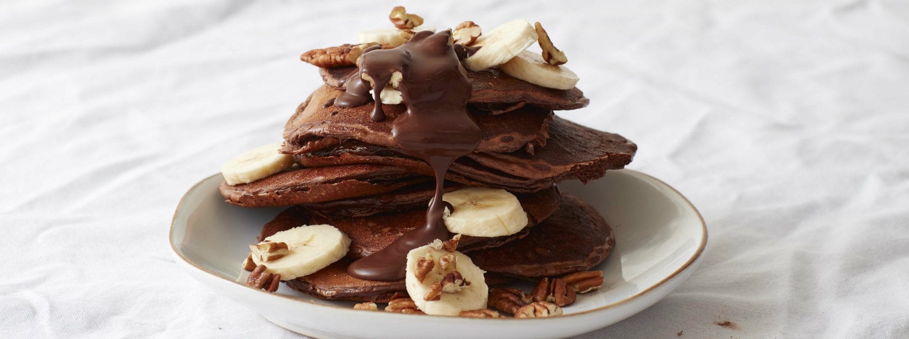 Banana Pecan Protein Pancakes with Gooey Chocolate Sauce