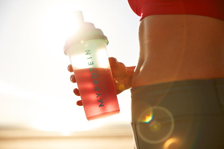 woman holding bcaa drink