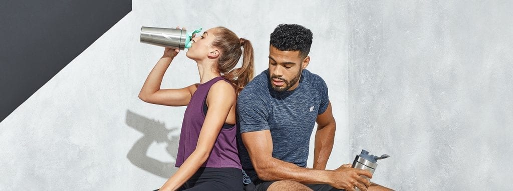 couple taking pre-workout together