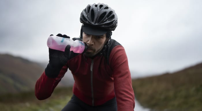 cyclist drinking BCAAs