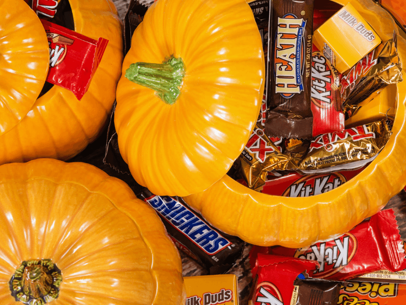 Various chocolate bars in a festive pumpkin bucket
