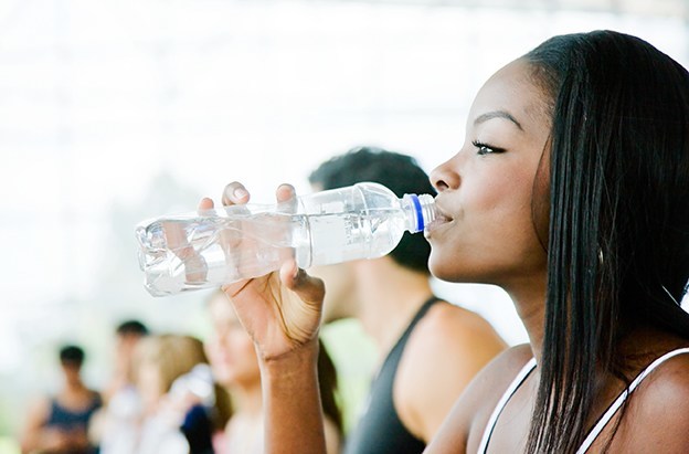 Gym woman drinking water