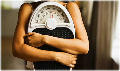 getty_rf_photo_of_woman_grasping_bathroom_scale