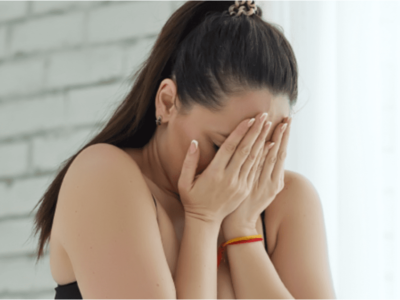 A girl crying after failing to lose weight